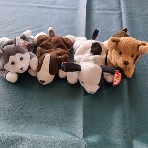 four ty beanie baby dogs huskie,bruno,spot, andtuffy